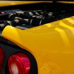 Detailed view of a yellow Ferrari F355 Spider at Noirmoutier-en-l'Île, ideal for automobile enthusiasts.